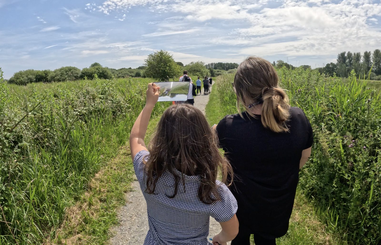 Children exploring a meadow on a sensory walk