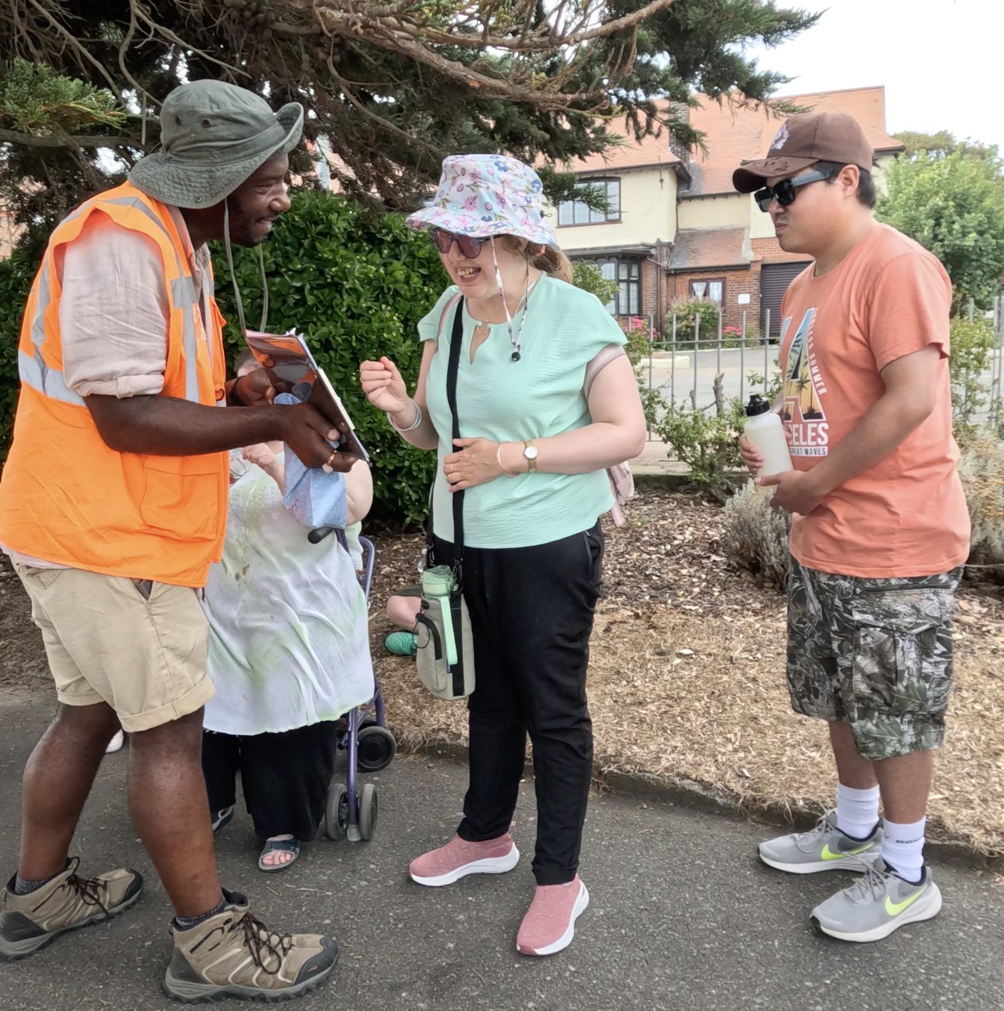 An inclusive sensory walk group, including a wheelchair user, exploring together